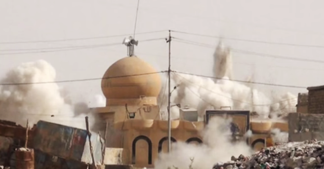 A screen shot taken from an ISIS propaganda video depicting the destruction of an Islamic heritage site in Iraq